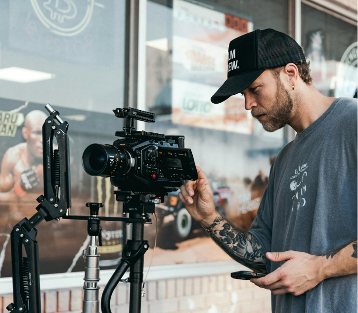 A video editor filming with modern camera and equipments