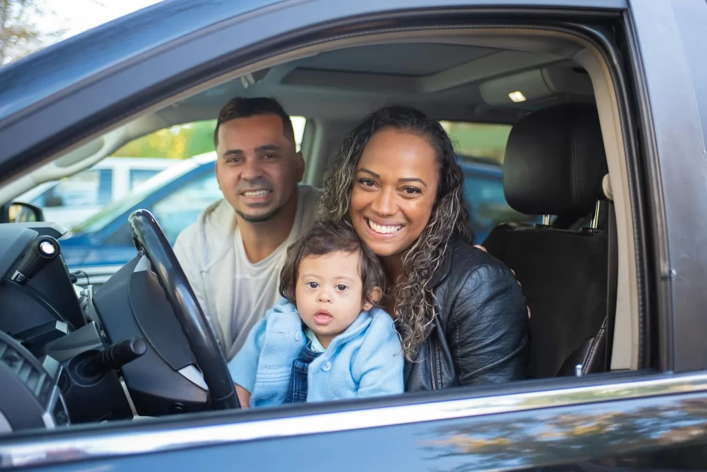 Car Advertisement with a man, woman and baby